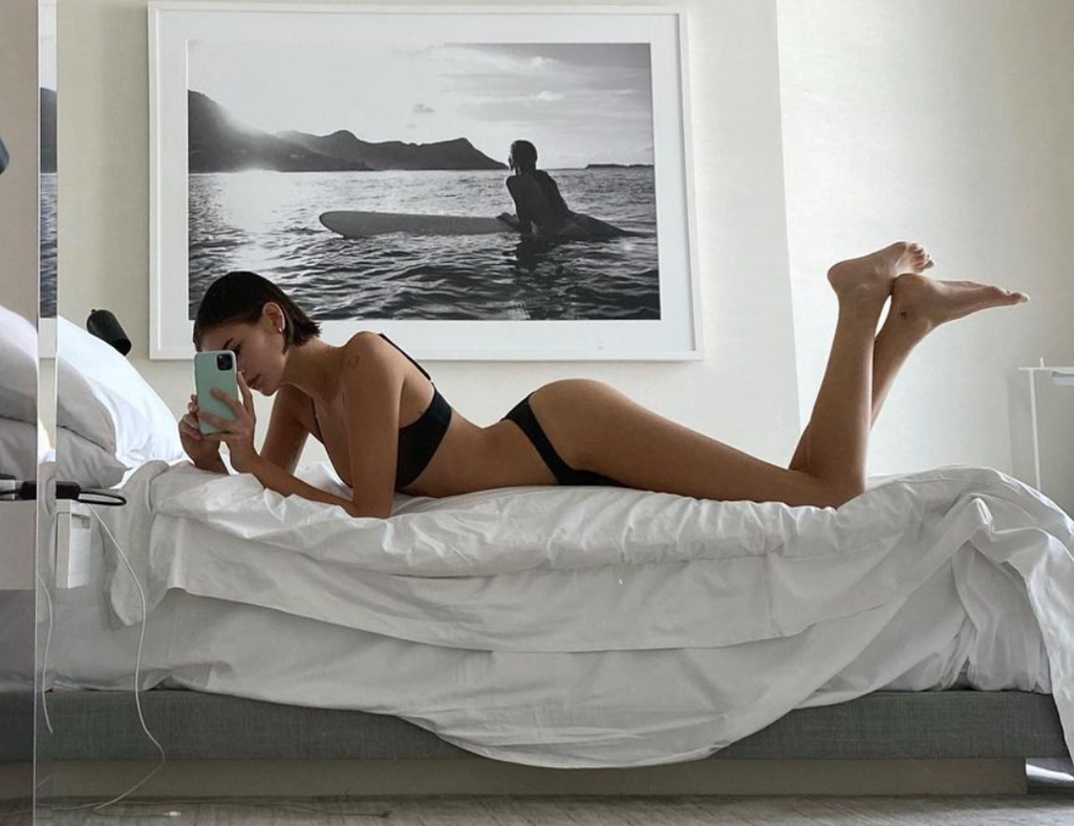 Kaia Gerber in minimal makeup and leather jacket